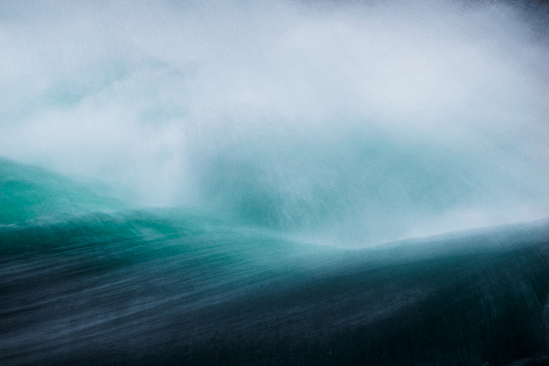 Misty teal wave in motion
